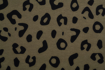 Cotton fabric with animal print. Animal pattern background or texture. Texture leopard.