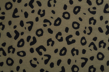 Cotton fabric with animal print. Animal pattern background or texture. Texture leopard.