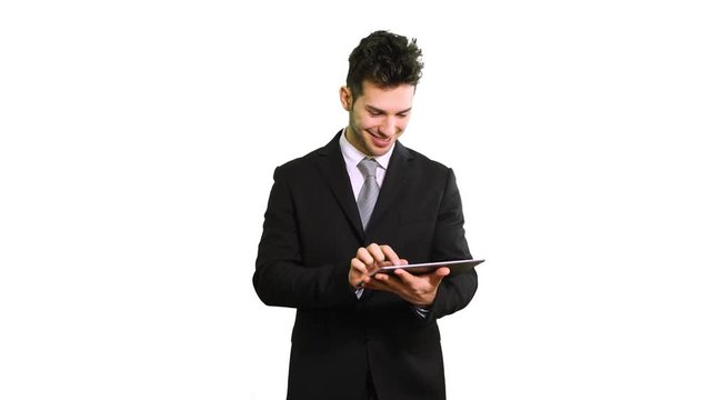 Portrait of a young businessman using a tablet computer
