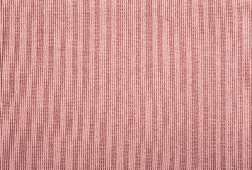 Pink cotton textile - close up of fabric texture. Cotton Fabric Texture. Top View of Cloth Textile Surface. Pink Clothing Background. Text Space. Abstract background and texture for designers.