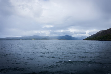 cloudy sky over the picturesque bay of the island of Scotland