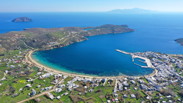 Aerial drone photo of beautiful Livadi beach and main port of Serifos island in spring, Cyclades, Greece