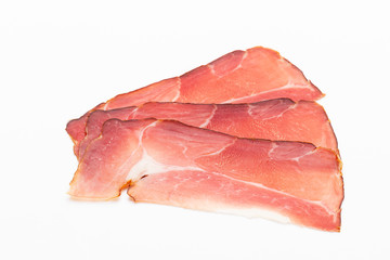 Hamon sliced on white background. Spanisch traditional meat.