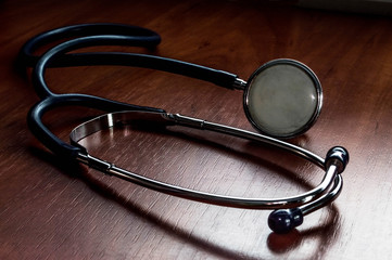 stethoscope on wooden background
