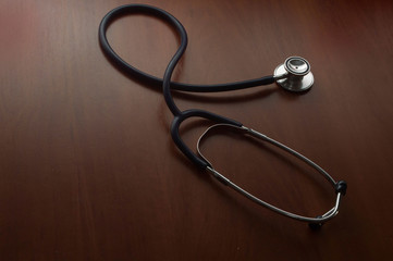 stethoscope on wooden background