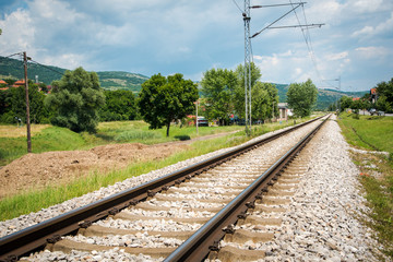 Fototapeta na wymiar Train railways in a sunny summer day. 