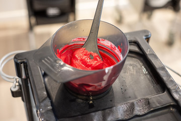 preparation for hair colouring in bowls and brush for hair colouring 