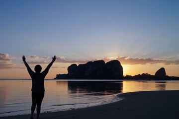 silhouette of a woman on the beach