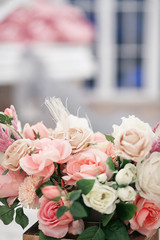 wedding decorations from flowers.   Bouquet of roses in a bright interior.