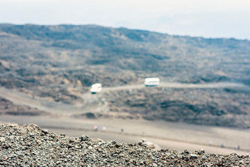 Buses on Mount Etna, active volcano on the east coast of Sicily, Italy.