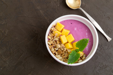 Homemade healthy berry yogurt. on dark background.