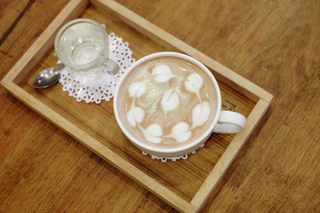Cup of delicious hot cocoa with milk foam in the morning at cafe shop 