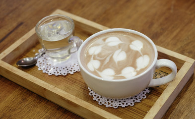 Cup of delicious hot cocoa with milk foam in the morning at cafe shop 