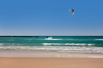 Beach landscape with the kitesurfer as the background