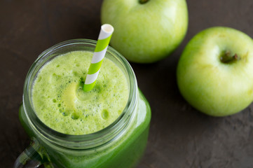 Healthy detox green smoothie in a mason jar.