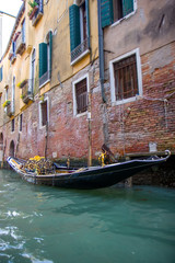 Naklejka na ściany i meble Buildings in narrow canal in Venice, Italy