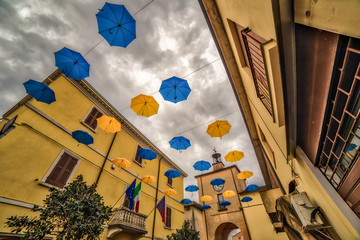 Blue and yellow umbrellas hanging