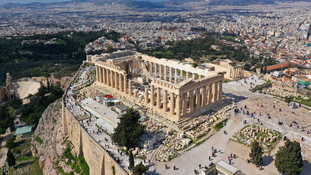 Aerial drone bird's eye view photo of iconic Acropolis hill and the Parthenon a masterpiece of Ancient world, Athens historic centre, Attica, Greece