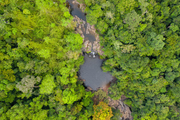 Aerial viewwaterfall in deep forest. Khlong Chao Waterfall in Koh Kood, Thailand