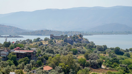 Fototapeta na wymiar Lake of Bafa and old castle ruins
