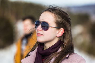 portrait of a young couple wearing sunglasses