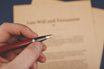 Notary's public pen and stamp on testament and last will. Notary public tools