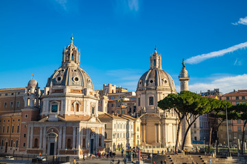 Fototapeta na wymiar Trajan Column, Catholic churches, pine trees, Piazza Venezia, Rome, Italy.