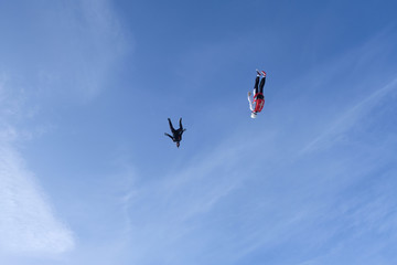 Plakat Skydiving. A flock of skydivers is flying in the sky.