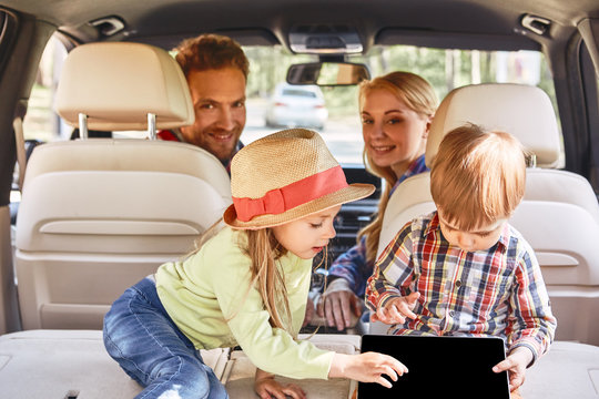 Let’s Wander Where The WiFi Is Weak. Cute Kids Playing Inside Car. Family Road Trip