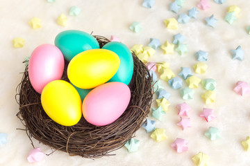 Multi-colored eggs in a nest