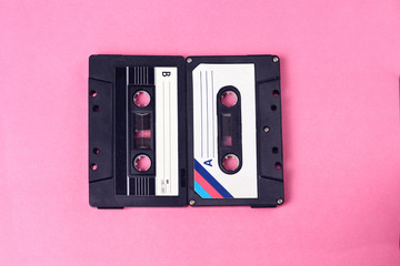 group of two audio retro vintage cassette tape 80s style on pink background