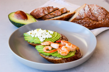 Healthy sandwiches with avocado and shrimp