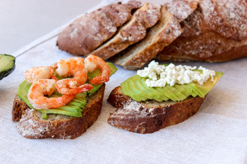 Healthy sandwiches with avocado and shrimp