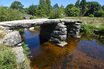 Ancient stone Clapper Bridge, Dartmoor, England.