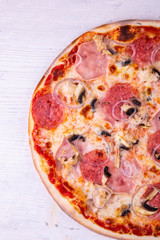 Meat pizza with a carbonate, chicken breast and salami