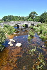 Ancient stone clapper bridge , Dartmoor, England.