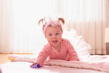 Fototapeta premium Crawling baby girl