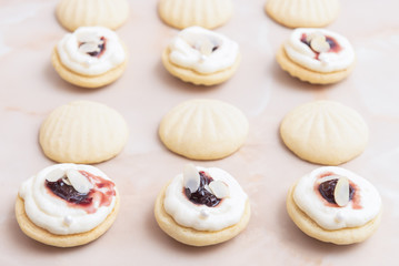 Cookies with white chocolate ganache, white pearl