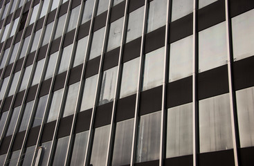 Old deteriorating building with glass windows