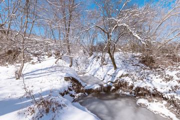 Frozen mountain river at winter season