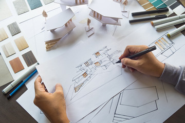 architect design working drawing sketch plans blueprints and making architectural construction...