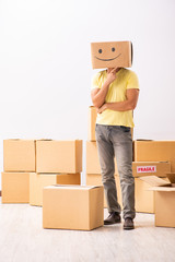 Happy man with box instead of his head 