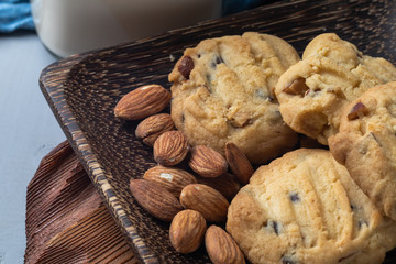 close up of almond cookies on wooden plate