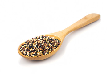 Mix seeds quinoa grains (white quinoa, black quinoa, red quinoa) in wooden spoon isolated on white background.Organic food and Healthy food concept
