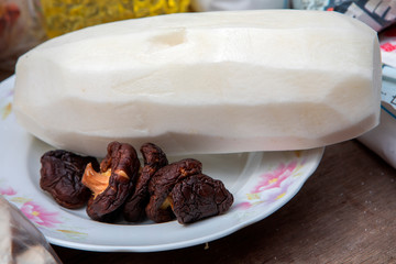Taiwanese religious beliefs, devout believers help prepare ceremonial offerings, mushrooms and radishes