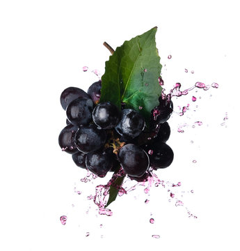 Bunch Of Grapes With Red Juice Splash Isolated On White Background