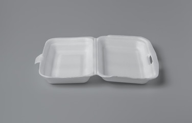 Open white styrofoam lunch box for takeaway food on grey background for print design and mock up