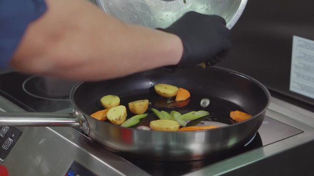 Chef cooking in restaurant.