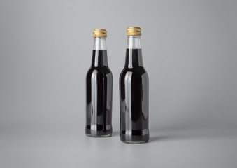 Mini wine bottle on grey background for print design and mock up