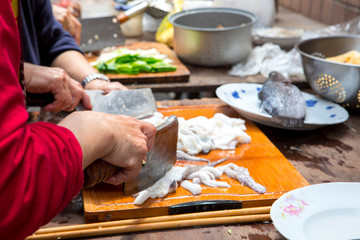 Traditional religious beliefs, devout believers prepare sacrifices, cut squid, squid